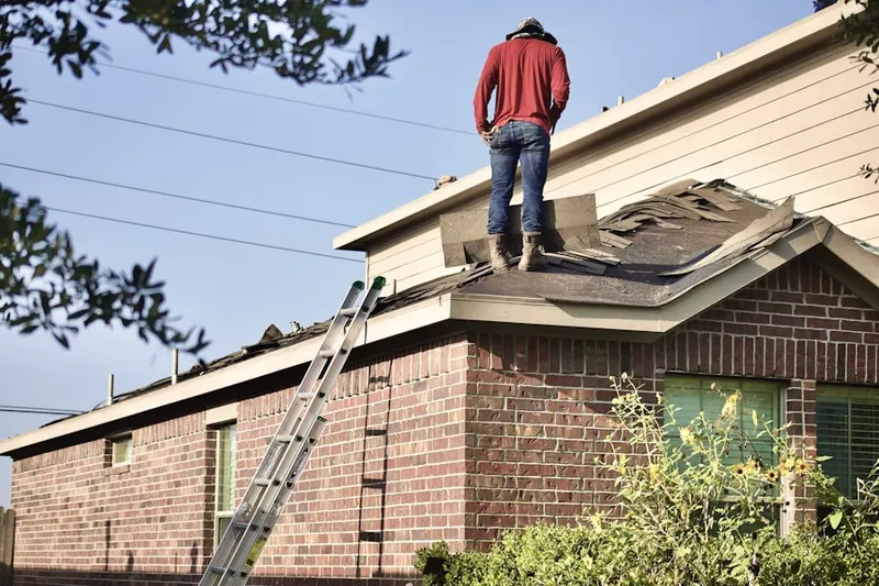Professional roofer working on a residential roof in Rusty Acres
